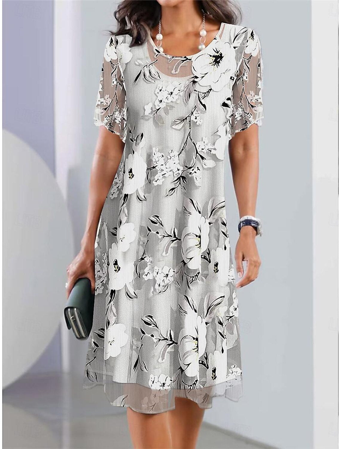 EP | Robe midi plissée et imprimée de fleurs pour un style élégant et confortable