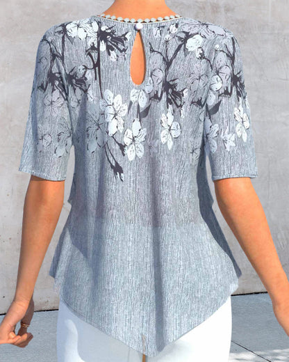 EP | Blouse à col rond fleuri et manches courtes